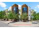 Contemporary condo exterior features mixed materials, balconies and lush, mature landscaping at 2335 Walnut St # 10, Denver, CO 80205