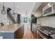 Contemporary kitchen featuring stainless steel appliances, granite counters, and modern cabinetry at 2335 Walnut St # 10, Denver, CO 80205