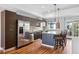 Well-lit kitchen with a modern island, stainless steel appliances, and plenty of cabinet space at 2335 Walnut St # 10, Denver, CO 80205