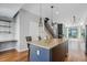Modern kitchen with granite countertops, stainless steel appliances, and an island with seating at 2335 Walnut St # 10, Denver, CO 80205