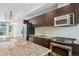 Sleek kitchen featuring stainless steel appliances, granite countertops, and modern cabinetry at 2335 Walnut St # 10, Denver, CO 80205