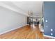 Open concept living room and kitchen with hardwood floors and gray accent wall at 2335 Walnut St # 10, Denver, CO 80205