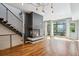 Living room with hardwood floors, fireplace, stairway and natural light at 2335 Walnut St # 10, Denver, CO 80205
