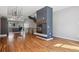 Living room with fireplace, hardwood floors and open access to kitchen at 2335 Walnut St # 10, Denver, CO 80205