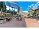 Inviting outdoor plaza with spacious seating, an entertainment screen, and an open-air ambiance for community gatherings at 2335 Walnut St # 10, Denver, CO 80205