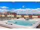 Rooftop jacuzzi with city views and blue sky at 2335 Walnut St # 10, Denver, CO 80205