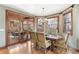 Charming dining room boasts wood floors, a chandelier, and access to an outdoor patio at 2411 S Garfield St, Denver, CO 80210