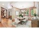 Dining room featuring modern decor, stylish lighting, hardwood floors, and access to other living spaces at 2411 S Garfield St, Denver, CO 80210