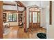 Beautiful foyer featuring wood floors, a grand arched front door, and entry to the study at 2411 S Garfield St, Denver, CO 80210
