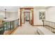Upstairs hallway showcasing architectural details, wood trim, and natural light at 2411 S Garfield St, Denver, CO 80210