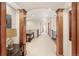 Spacious upstairs hallway with ornate wooden columns and view to multiple rooms at 2411 S Garfield St, Denver, CO 80210