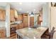 Open-concept kitchen with a large island, custom cabinets, and stainless steel appliances, great for gatherings and cooking at 2411 S Garfield St, Denver, CO 80210