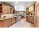 Spacious kitchen with wood cabinets, granite countertops, and stainless steel appliances at 2411 S Garfield St, Denver, CO 80210