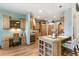 Bright kitchen featuring custom wood cabinetry, granite countertops, and a functional island at 2411 S Garfield St, Denver, CO 80210