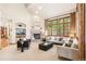 Elegant living room with fireplace, large windows, and neutral color palette throughout at 2411 S Garfield St, Denver, CO 80210