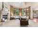 Bright living room features large windows with natural light, a cozy fireplace, and neutral decor at 2411 S Garfield St, Denver, CO 80210