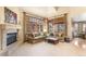 Spacious living room features a fireplace, large windows, and comfortable sofas, perfect for relaxing or entertaining at 2411 S Garfield St, Denver, CO 80210