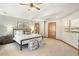 This large main bedroom has a vaulted ceiling, ample natural light, and stylish decor at 2411 S Garfield St, Denver, CO 80210