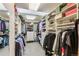 A walk-in closet with an abundance of hanging storage, shelving, and drawers at 2411 S Garfield St, Denver, CO 80210