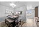 Dining room with a modern light fixture and access to the kitchen at 23500 E Alamo Pl # B19, Aurora, CO 80016
