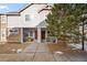 Inviting townhome exterior featuring a cozy porch and well-maintained landscaping at 23500 E Alamo Pl # B19, Aurora, CO 80016