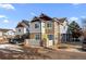 Well-maintained townhome showcasing stone accents and a neatly landscaped front yard at 23500 E Alamo Pl # B19, Aurora, CO 80016