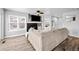 Spacious living room with wood floors, a fireplace, and comfortable seating at 23500 E Alamo Pl # B19, Aurora, CO 80016