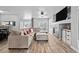 Comfortable living room with a fireplace, large sectional, and wood-look flooring at 23500 E Alamo Pl # B19, Aurora, CO 80016