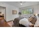 Inviting bedroom with a scenic window and comfortable furnishings at 1201 Race St # 10, Denver, CO 80206