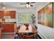 Cozy dining area with hardwood floors, a large window, and a view of the trees outside at 1201 Race St # 10, Denver, CO 80206