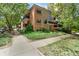 Charming brick condo building with lush landscaping and mature trees in a desirable location at 1201 Race St # 10, Denver, CO 80206