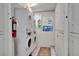 Well-maintained laundry room with stacked washer and dryer units for convenience at 1201 Race St # 10, Denver, CO 80206