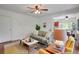 Comfortable living room with hardwood floors, neutral decor, and lots of natural light at 1201 Race St # 10, Denver, CO 80206