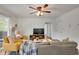 Bright and airy living room with hardwood floors and a view of the balcony and outdoors at 1201 Race St # 10, Denver, CO 80206