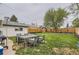 Well-manicured backyard featuring privacy fence, new grass, patio furniture, and detached garage at 3930 S Sherman St, Englewood, CO 80113