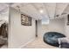 Finished basement with carpet, exposed beams, and flexible lounging space at 3930 S Sherman St, Englewood, CO 80113