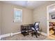 Home office area in bedroom with a modern desk and chair near a bright window at 3930 S Sherman St, Englewood, CO 80113
