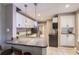 Modern kitchen featuring white cabinets, stainless steel appliances, and granite countertops at 3930 S Sherman St, Englewood, CO 80113