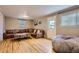 Inviting living room featuring hardwood floors, a comfortable sectional sofa, and natural light at 3930 S Sherman St, Englewood, CO 80113