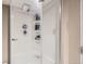 Bright shower with multiple shelves for storage inside of glass-enclosed stall at 3930 S Sherman St, Englewood, CO 80113