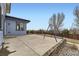 This backyard has a patio area and a swing set, perfect for entertaining and to play at 10910 Touchstone Loop, Parker, CO 80134