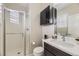 Bright bathroom with walk-in shower, vanity, and modern fixtures at 10910 Touchstone Loop, Parker, CO 80134
