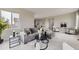 Spacious living room featuring a comfortable gray sectional sofa and elegant decor at 10910 Touchstone Loop, Parker, CO 80134