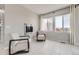 Cozy sitting area with modern chairs, a sleek fireplace, and views from the windows at 10910 Touchstone Loop, Parker, CO 80134