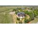 Aerial view of a home with a sprawling lawn, landscaped yard, and a patio, nestled in a lush green neighborhood at 14958 Wistera Way, Broomfield, CO 80023