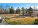 Large backyard with mature trees and privacy fence at 14958 Wistera Way, Broomfield, CO 80023