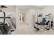 Spacious basement with gym featuring a treadmill and weight machine at 14958 Wistera Way, Broomfield, CO 80023