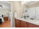 A spacious bathroom features dual sinks with light fixtures above at 14958 Wistera Way, Broomfield, CO 80023