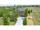 Stunning two-story home with lush landscaping, a concrete driveway, and a three-car garage at 14958 Wistera Way, Broomfield, CO 80023