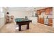 Entertainment area with a pool table and a partial kitchen with stainless steel appliances at 14958 Wistera Way, Broomfield, CO 80023